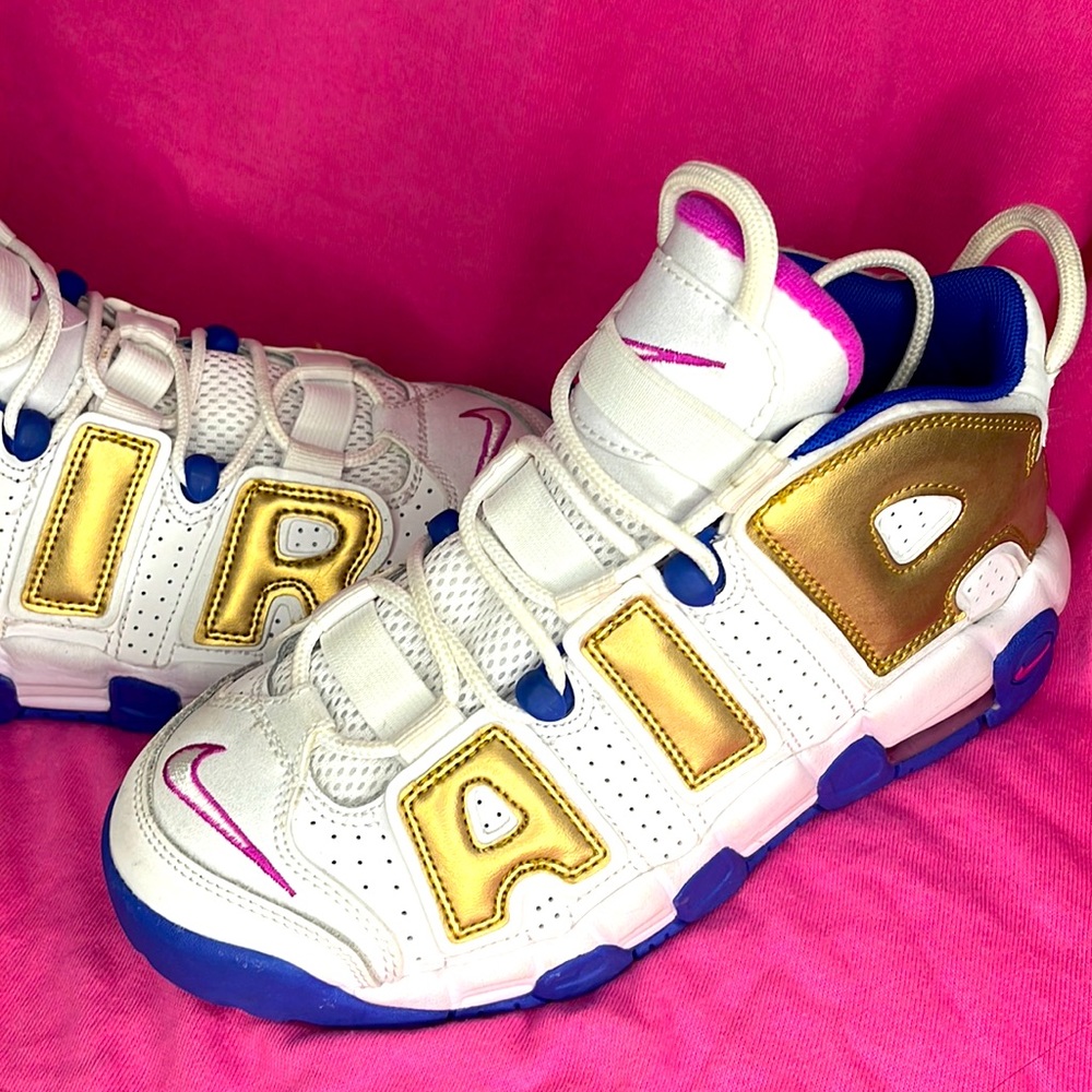 Blue pink white and gold Nike air Jordan’s